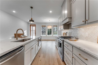 Open  floor plan with beamed vaulted ceiling. The split floor on Bella Vista - Metfield Golf Complex and Country Club in Arkansas - for sale on GolfHomes.com, golf home, golf lot