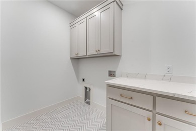 Open  floor plan with beamed vaulted ceiling. The split floor on Bella Vista - Metfield Golf Complex and Country Club in Arkansas - for sale on GolfHomes.com, golf home, golf lot