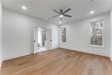 Open  floor plan with beamed vaulted ceiling. The split floor on Bella Vista - Metfield Golf Complex and Country Club in Arkansas - for sale on GolfHomes.com, golf home, golf lot