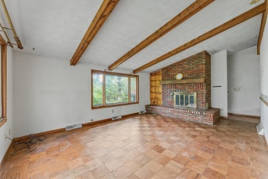 Rare opportunity! This 3 bed, 2 bath fixer-upper sits on over 2 on Baraboo Country Club in Wisconsin - for sale on GolfHomes.com, golf home, golf lot
