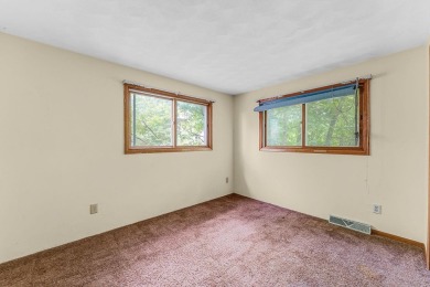 Rare opportunity! This 3 bed, 2 bath fixer-upper sits on over 2 on Baraboo Country Club in Wisconsin - for sale on GolfHomes.com, golf home, golf lot