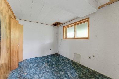 Rare opportunity! This 3 bed, 2 bath fixer-upper sits on over 2 on Baraboo Country Club in Wisconsin - for sale on GolfHomes.com, golf home, golf lot