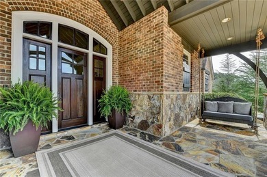 Rustic elegance is realized in this five bedroom, seven and a on The River Club in Georgia - for sale on GolfHomes.com, golf home, golf lot