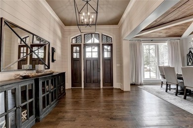 Rustic elegance is realized in this five bedroom, seven and a on The River Club in Georgia - for sale on GolfHomes.com, golf home, golf lot