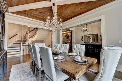 Rustic elegance is realized in this five bedroom, seven and a on The River Club in Georgia - for sale on GolfHomes.com, golf home, golf lot