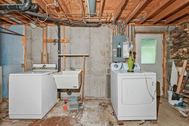 Rare opportunity! This 3 bed, 2 bath fixer-upper sits on over 2 on Baraboo Country Club in Wisconsin - for sale on GolfHomes.com, golf home, golf lot