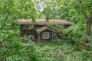 Rare opportunity! This 3 bed, 2 bath fixer-upper sits on over 2 on Baraboo Country Club in Wisconsin - for sale on GolfHomes.com, golf home, golf lot