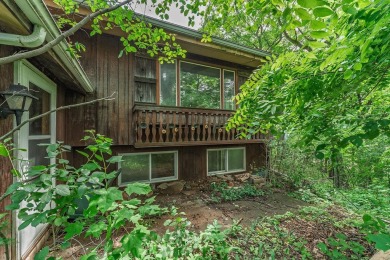 Rare opportunity! This 3 bed, 2 bath fixer-upper sits on over 2 on Baraboo Country Club in Wisconsin - for sale on GolfHomes.com, golf home, golf lot