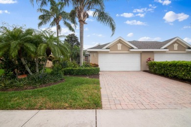 Nestled in the heart of Viera East Golf Course, this villa on Viera East Golf Club in Florida - for sale on GolfHomes.com, golf home, golf lot