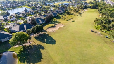 Nestled in the heart of Viera East Golf Course, this villa on Viera East Golf Club in Florida - for sale on GolfHomes.com, golf home, golf lot