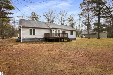 Nestled on a spacious, wooded lot, this welcoming home combines on Twin Birch Golf Club in Michigan - for sale on GolfHomes.com, golf home, golf lot