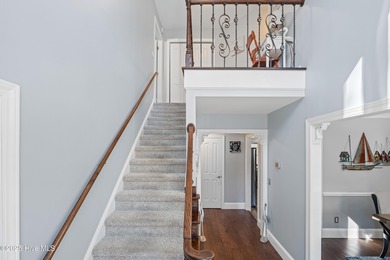 Discover this beautifully remodeled, brick traditional two-story on Oak Island Golf Club in North Carolina - for sale on GolfHomes.com, golf home, golf lot