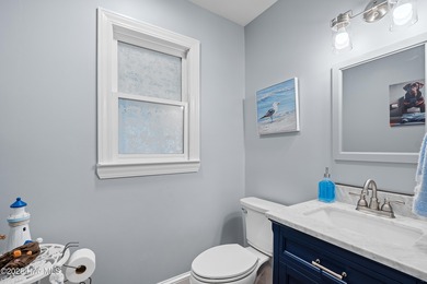 Discover this beautifully remodeled, brick traditional two-story on Oak Island Golf Club in North Carolina - for sale on GolfHomes.com, golf home, golf lot