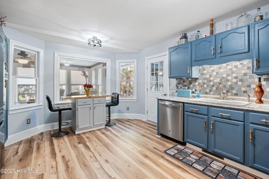 Discover this beautifully remodeled, brick traditional two-story on Oak Island Golf Club in North Carolina - for sale on GolfHomes.com, golf home, golf lot