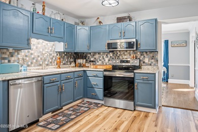 Discover this beautifully remodeled, brick traditional two-story on Oak Island Golf Club in North Carolina - for sale on GolfHomes.com, golf home, golf lot