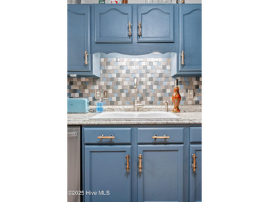 Discover this beautifully remodeled, brick traditional two-story on Oak Island Golf Club in North Carolina - for sale on GolfHomes.com, golf home, golf lot