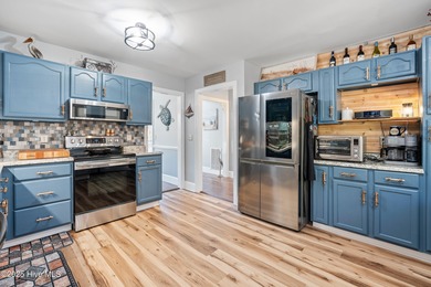 Discover this beautifully remodeled, brick traditional two-story on Oak Island Golf Club in North Carolina - for sale on GolfHomes.com, golf home, golf lot