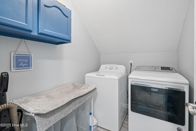 Discover this beautifully remodeled, brick traditional two-story on Oak Island Golf Club in North Carolina - for sale on GolfHomes.com, golf home, golf lot