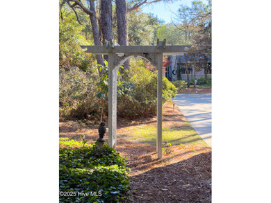 Discover this beautifully remodeled, brick traditional two-story on Oak Island Golf Club in North Carolina - for sale on GolfHomes.com, golf home, golf lot