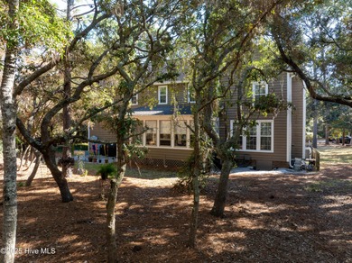 Discover this beautifully remodeled, brick traditional two-story on Oak Island Golf Club in North Carolina - for sale on GolfHomes.com, golf home, golf lot
