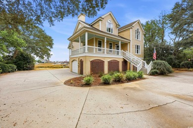 Set on a generous .44-acre homesite and positioned along one of on Pawleys Plantation Golf and Country Club in South Carolina - for sale on GolfHomes.com, golf home, golf lot