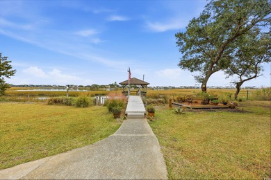 Set on a generous .44-acre homesite and positioned along one of on Pawleys Plantation Golf and Country Club in South Carolina - for sale on GolfHomes.com, golf home, golf lot