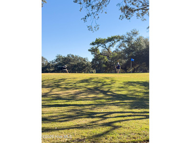 Discover this beautifully remodeled, brick traditional two-story on Oak Island Golf Club in North Carolina - for sale on GolfHomes.com, golf home, golf lot