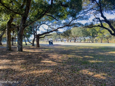 Discover this beautifully remodeled, brick traditional two-story on Oak Island Golf Club in North Carolina - for sale on GolfHomes.com, golf home, golf lot