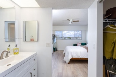 This beautifully updated 4th -floor condo offers stunning lake on Flamingo Lakes Country Club in Florida - for sale on GolfHomes.com, golf home, golf lot