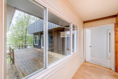Enjoy breathtaking water views from this spacious 4-bedroom on St. Ives Golf Club in Michigan - for sale on GolfHomes.com, golf home, golf lot