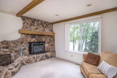 Enjoy breathtaking water views from this spacious 4-bedroom on St. Ives Golf Club in Michigan - for sale on GolfHomes.com, golf home, golf lot