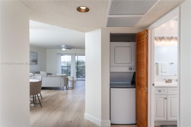 This beautifully updated 4th -floor condo offers stunning lake on Flamingo Lakes Country Club in Florida - for sale on GolfHomes.com, golf home, golf lot