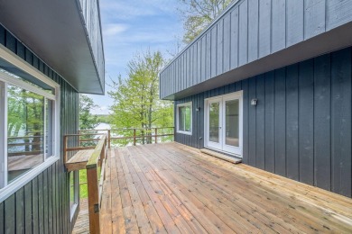 Enjoy breathtaking water views from this spacious 4-bedroom on St. Ives Golf Club in Michigan - for sale on GolfHomes.com, golf home, golf lot