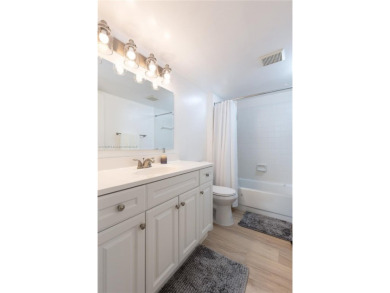This beautifully updated 4th -floor condo offers stunning lake on Flamingo Lakes Country Club in Florida - for sale on GolfHomes.com, golf home, golf lot