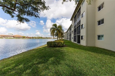 This beautifully updated 4th -floor condo offers stunning lake on Flamingo Lakes Country Club in Florida - for sale on GolfHomes.com, golf home, golf lot