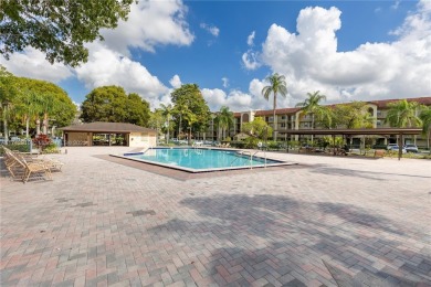 This beautifully updated 4th -floor condo offers stunning lake on Flamingo Lakes Country Club in Florida - for sale on GolfHomes.com, golf home, golf lot