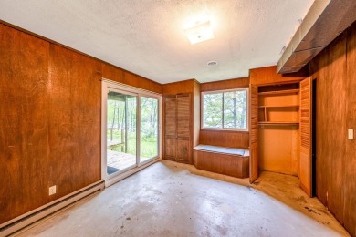 Enjoy breathtaking water views from this spacious 4-bedroom on St. Ives Golf Club in Michigan - for sale on GolfHomes.com, golf home, golf lot