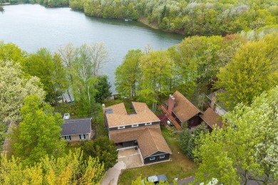 Enjoy breathtaking water views from this spacious 4-bedroom on St. Ives Golf Club in Michigan - for sale on GolfHomes.com, golf home, golf lot