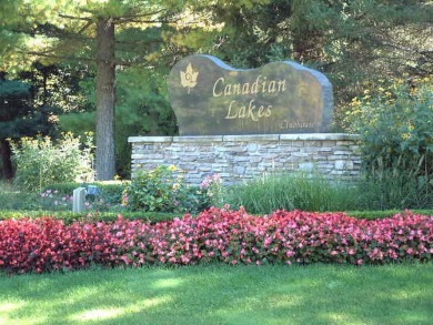 Enjoy breathtaking water views from this spacious 4-bedroom on St. Ives Golf Club in Michigan - for sale on GolfHomes.com, golf home, golf lot