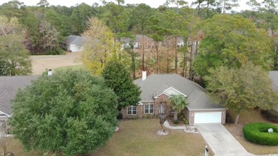 Located in a gated golf community, this brick-front 4-bed on Wachesaw Plantation East Golf Course in South Carolina - for sale on GolfHomes.com, golf home, golf lot