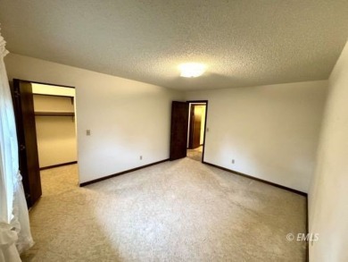 This charming raised ranch home sits on a quiet cul-de-sac that on Miles City Town and Country Club in Montana - for sale on GolfHomes.com, golf home, golf lot