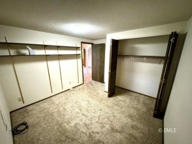 This charming raised ranch home sits on a quiet cul-de-sac that on Miles City Town and Country Club in Montana - for sale on GolfHomes.com, golf home, golf lot