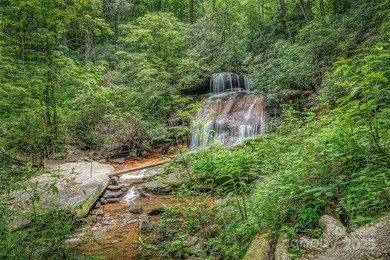 This great lot in Connestee Falls offers easy building on a on Connestee Falls Golf Club in North Carolina - for sale on GolfHomes.com, golf home, golf lot