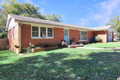 Adorable 3 bedroom home located on a large corner lot within on Mayfield-Graves Country Club in Kentucky - for sale on GolfHomes.com, golf home, golf lot