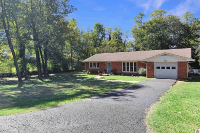 Adorable 3 bedroom home located on a large corner lot within on Mayfield-Graves Country Club in Kentucky - for sale on GolfHomes.com, golf home, golf lot