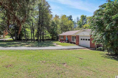 Adorable 3 bedroom home located on a large corner lot within on Mayfield-Graves Country Club in Kentucky - for sale on GolfHomes.com, golf home, golf lot