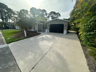 This beautifully remodeled Palm Harbor stucco home is a on Del Tura Golf and Country Club in Florida - for sale on GolfHomes.com, golf home, golf lot