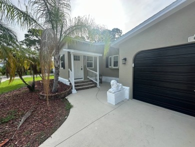 This beautifully remodeled Palm Harbor stucco home is a on Del Tura Golf and Country Club in Florida - for sale on GolfHomes.com, golf home, golf lot