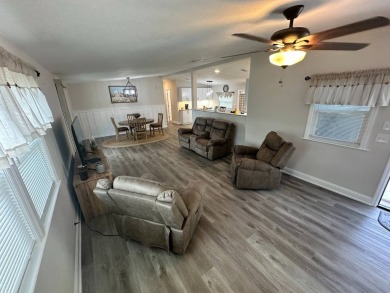 This beautifully remodeled Palm Harbor stucco home is a on Del Tura Golf and Country Club in Florida - for sale on GolfHomes.com, golf home, golf lot