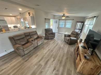 This beautifully remodeled Palm Harbor stucco home is a on Del Tura Golf and Country Club in Florida - for sale on GolfHomes.com, golf home, golf lot